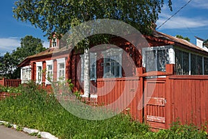 Wooden country house with front garden in Russia