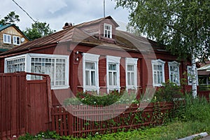 Wooden country house with front garden in Russia