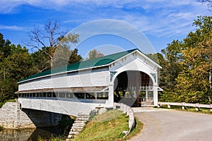 A Wooden Covered Bridge in the countyside of rural America photo