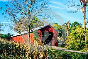 A Wooden Covered Bridge in the countyside of rural America photo