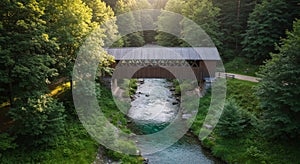 Wooden Covered Bridge Over a River in a Lush Green Forest