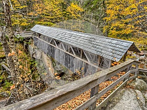 Wooden covered bridge spanning a gorge