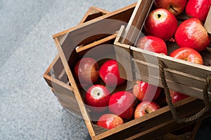 Wooden crate box full of fresh red apples