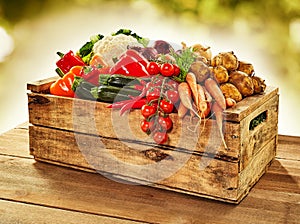 Wooden crate filled with farm fresh vegetables