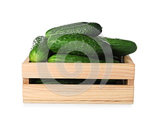 Wooden crate full of fresh ripe cucumbers