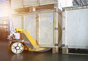 Wooden crate with Hand Pallet Jack in Storage Warehouse. Supply Chain. Cargo Boxes Shipment. Shipping Warehouse Logistics