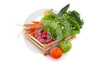 Wooden crate with vegetables and fruit