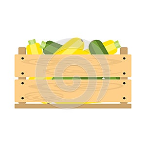 Wooden crate with zucchini