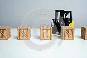 Wooden crates and forklift. Production and freight of goods. Transport department. Effective logistics and supply chain management