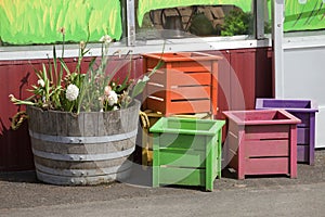 Wooden crates and old half barrell.