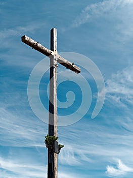 wooden cross against blue sky