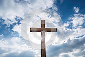 wooden cross against cloudy sky