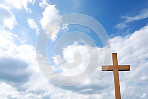 wooden cross against cloudy sky