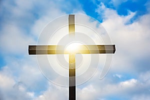 Wooden cross against sky background   ,