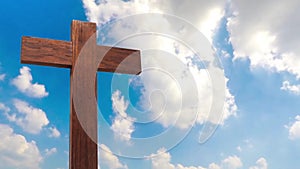 Wooden cross on the blue sky cloudy