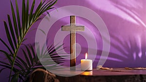 Wooden cross, candle and palm leaves on purple background