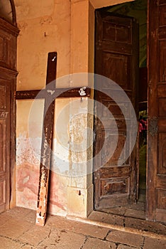 Wooden cross by church entrance