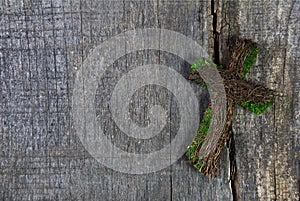 Wooden cross or crucifix on a background for a condolence card.