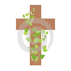 Wooden cross decorated with green branches. Easter