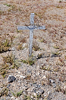 Wooden cross on desert grave