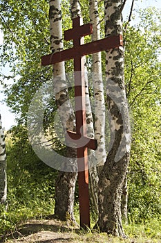 Wooden cross in the forest