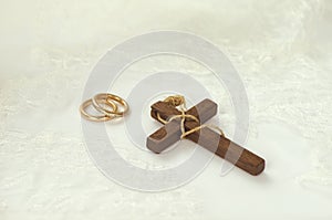 Wooden cross with golden rings