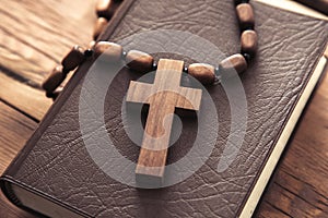 Wooden cross on the Holy Bible