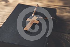 wooden cross on the Holy Bible