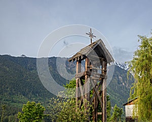 Wooden cross in the rocky mountains