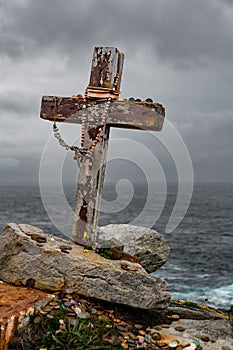 Wooden cross on the seashore in Malin Head, County Donegal, Ireland