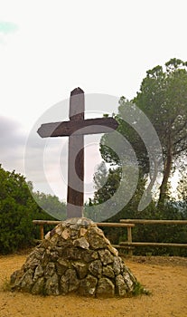 Wooden cross on stone base photo