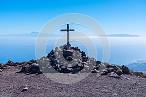 Wooden cross, Tenerife and La Gomera viewed from Pico de la Nieve at La Palma, Canary islands, Spain photo