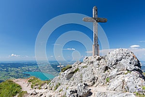 Wooden cross at top Austrain Schafberg with view at Mondsee