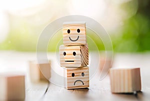 Wooden cube block shape with icon face smiley, The best excellent business services rating customer experience,Satisfaction survey