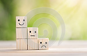 Wooden cube block shape with icon face smiley, The best excellent business services rating customer experience,Satisfaction survey