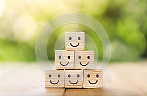 Wooden cube block shape with icon face smiley, The best excellent business services rating customer experience,Satisfaction survey