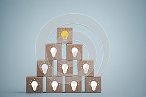 Wooden cube block tower with light bulb icon on white background, Conceptual of creative idea and innovation, New business idea, C