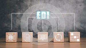 Wooden cube block with virtual screen EDI icon on wooden desk