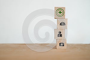 Wooden cube blocks with safety at workplace icon for safe for work concept, Employees safety awareness at workplace. Safety banner