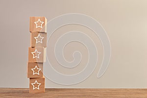 Wooden cube blocks with stars. Excellent business services rating customer experience concept