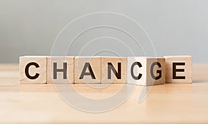 Wooden cube flip with word `change` to `chance` on wood table, Personal development and career growth or change yourself concept