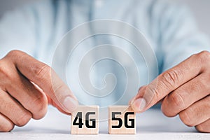 Wooden cube handle to turn 4G into 5G  5th Generation, technology turns the transition to high speed and the Internet of things