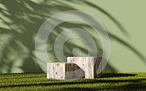 Wooden cube shaped stands or podiums on green grass of a garden for product display