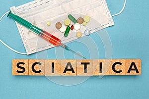 Wooden cube with text Sciatica