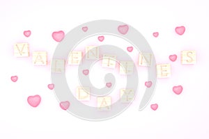Wooden cube Valentime`s dayand and pink hear backgground