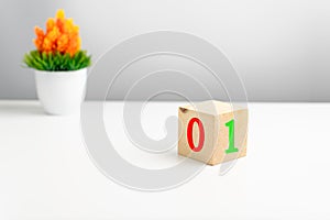 A wooden cube on a white table with text TRUE, FALSE. Concept of development and coding, programmer software, app, prototype,