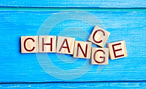 Wooden cube with word `change` to `chance` on wood table. Personal development and career growth or change yourself concept. conce