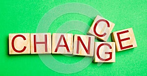 Wooden cube with word `change` to `chance` on wood table. Personal development and career growth or change yourself concept. conce