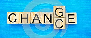 Wooden cube with word `change` to `chance` on wood table. Personal development and career growth or change yourself concept. conce