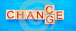 Wooden cube with word `change` to `chance` on wood table. Personal development and career growth or change yourself concept. conce